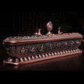 Dark copper Tibetan incense burner with floral lid ornaments and engraved side panels on black background